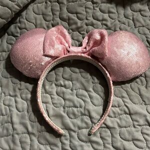 Pink sequined Minnie Mouse ears headband.